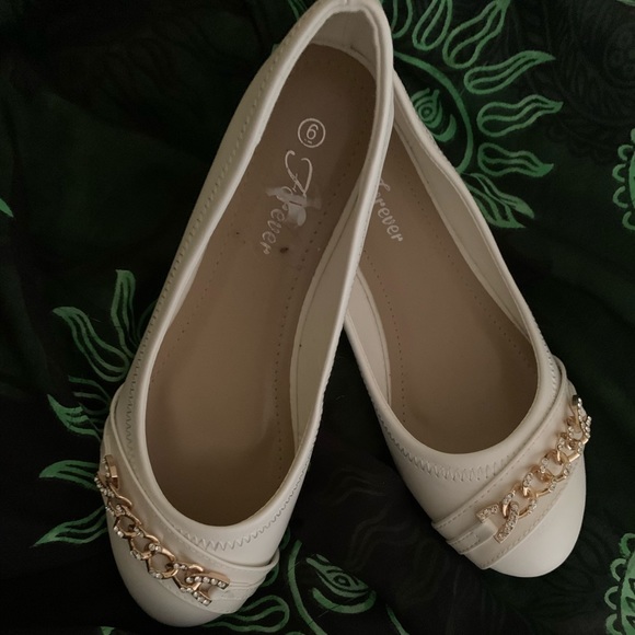 white and gold flats